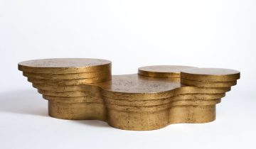 A minimalist coffee table with hand-applied golden leaf