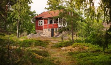 A Traditional Swedish Cottage by the Sea with a Splash of Colour