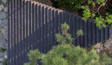 Temp adds “serene” charred timber pavilion to Shanghai garden