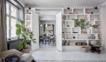 Historic Swedish home with light grey walls and a dark grey kitchen