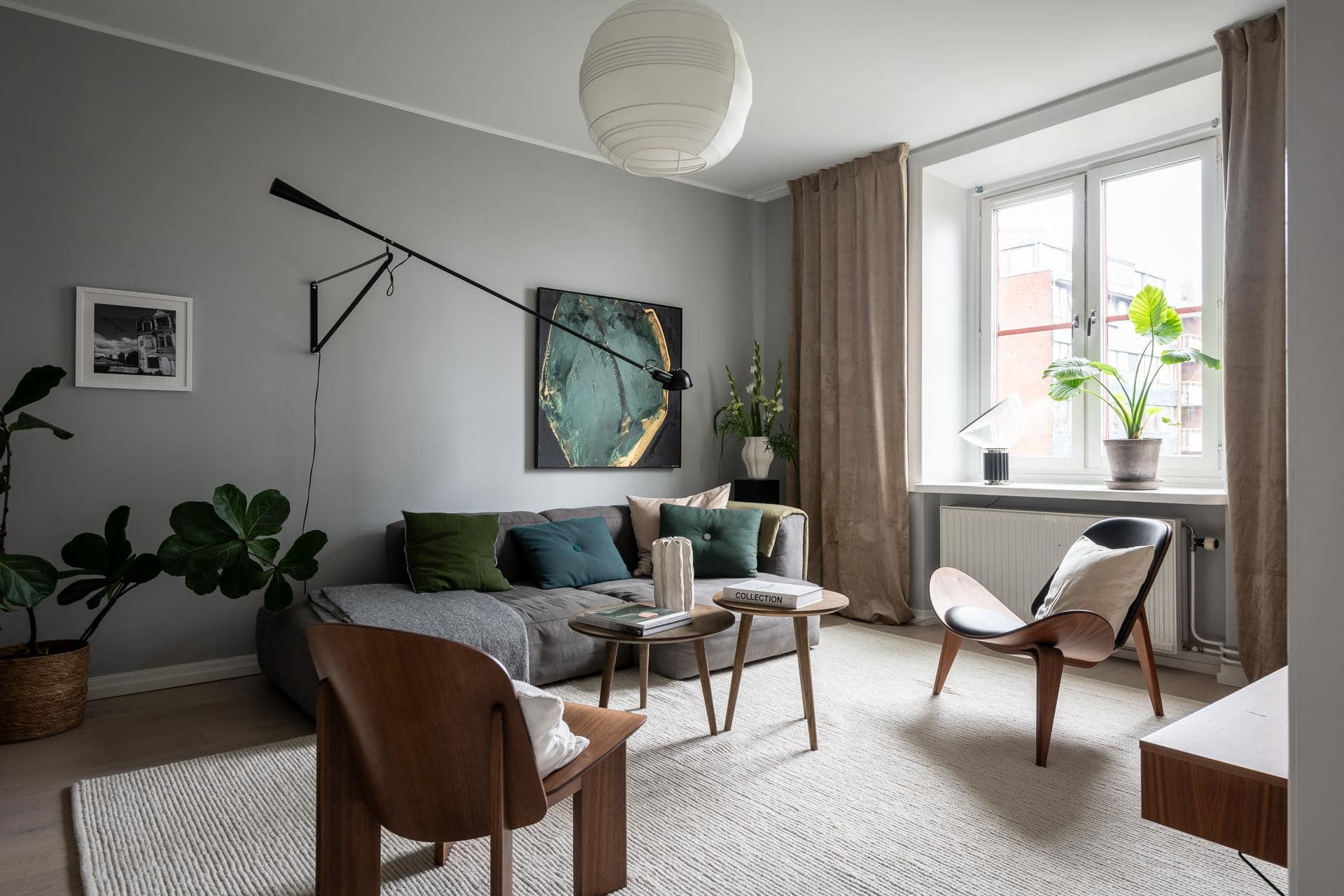 A Historic Flat With Grey Walls Green Accents And A Dark Blue Bedroom1.jpg