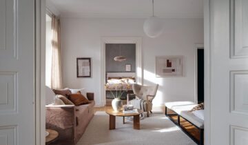 A historic Swedish apartment with grey limewash accent walls