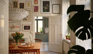 A historic apartment with a green kitchen and a vintage touch