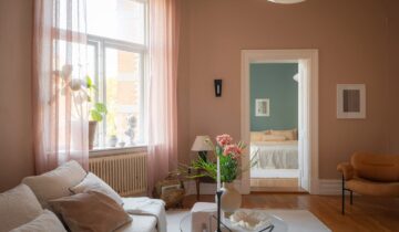 A pastel pink living room paired with blue bedroom walls