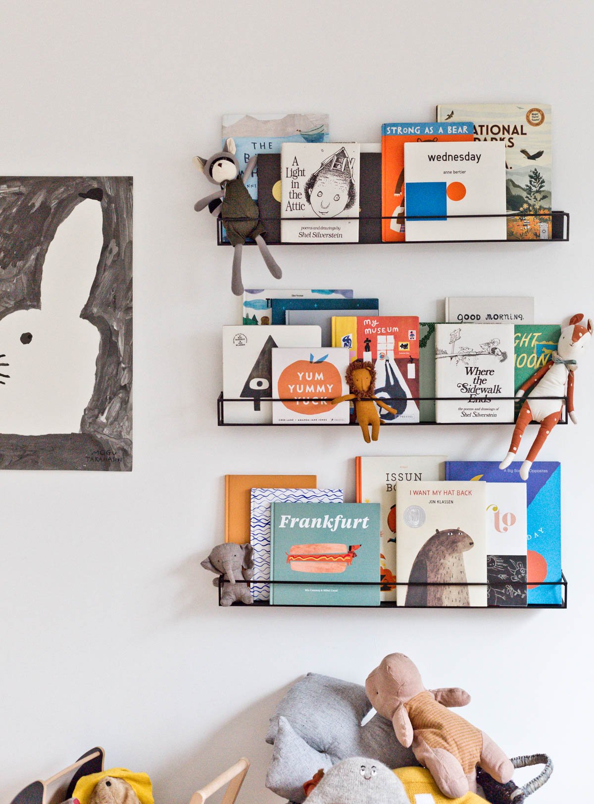 black floating shelves with colorful children