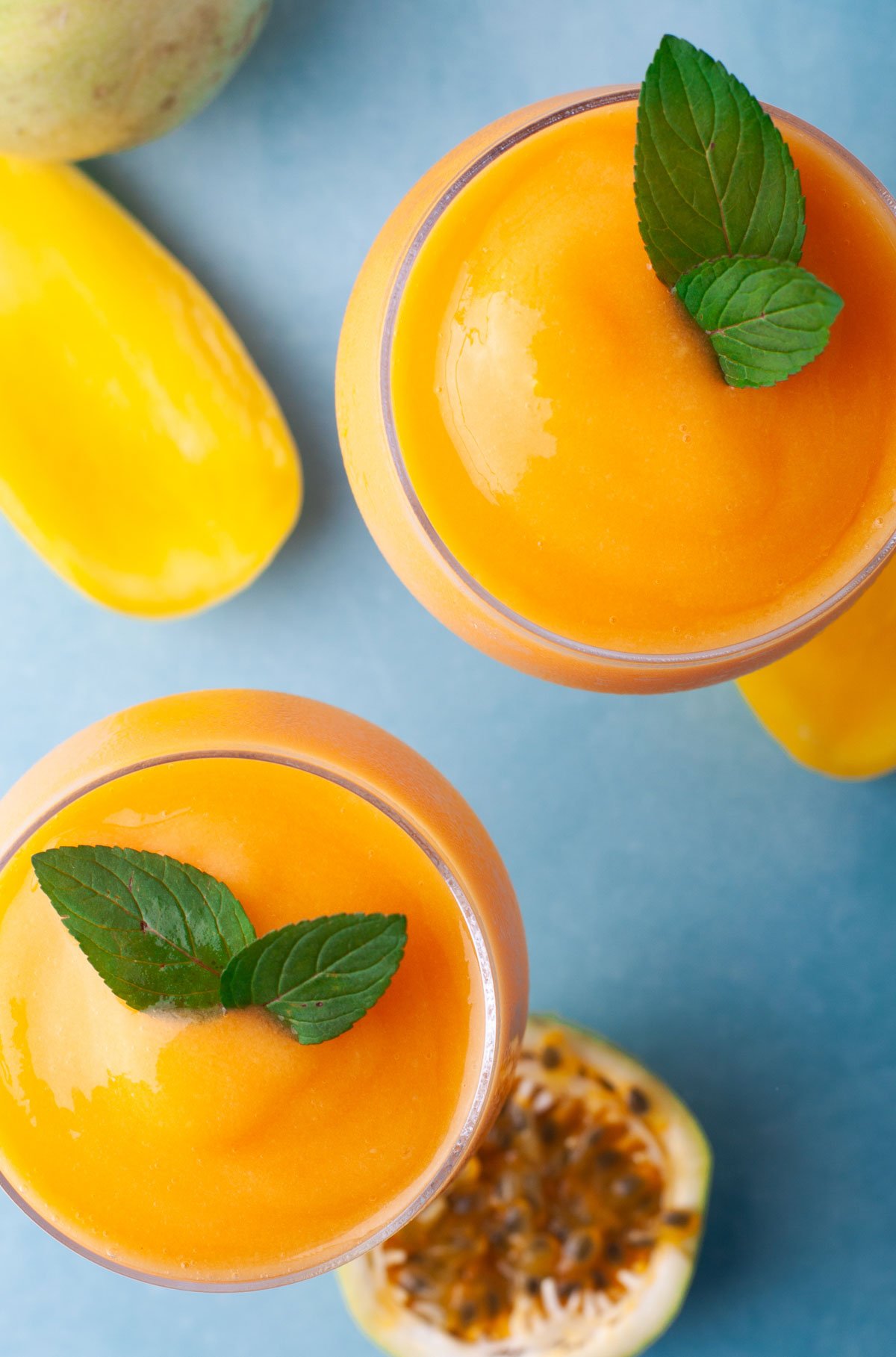 closeup overhead of orange frozen cocktail in long stem glassware