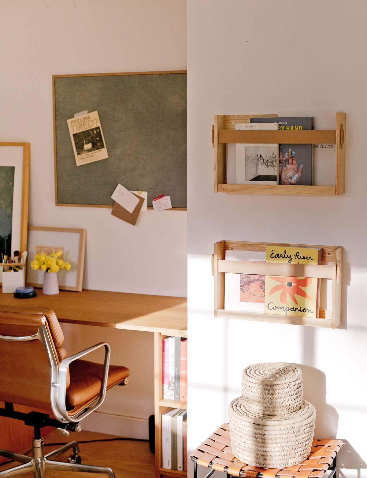 modern wood desk in a small bedroom closet with open shelving