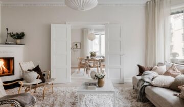 Bright historic flat with a beige shaker kitchen