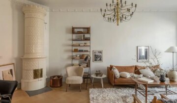 A classic brown living room decor and wainscoting in the bedroom